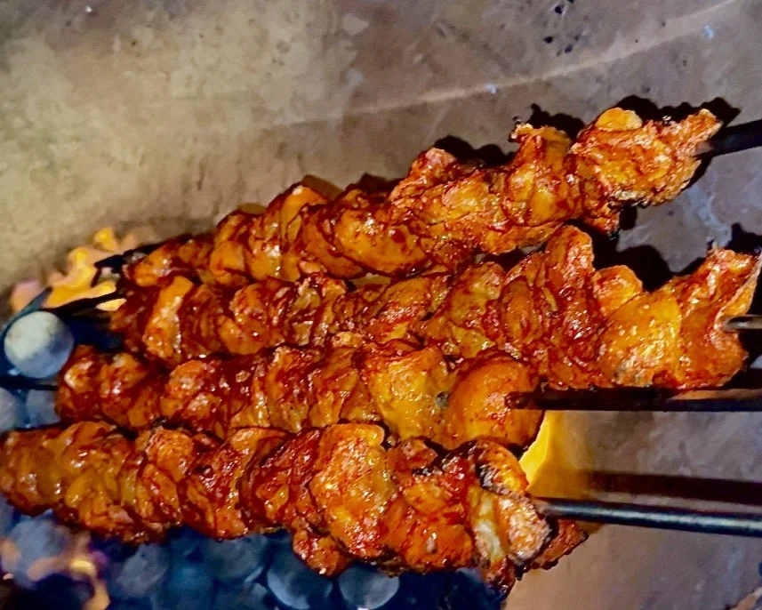 Chicken tikka skewers cooking in the tandoor at Chandigarh Curry House — serving Cliff Bungalow Calgary